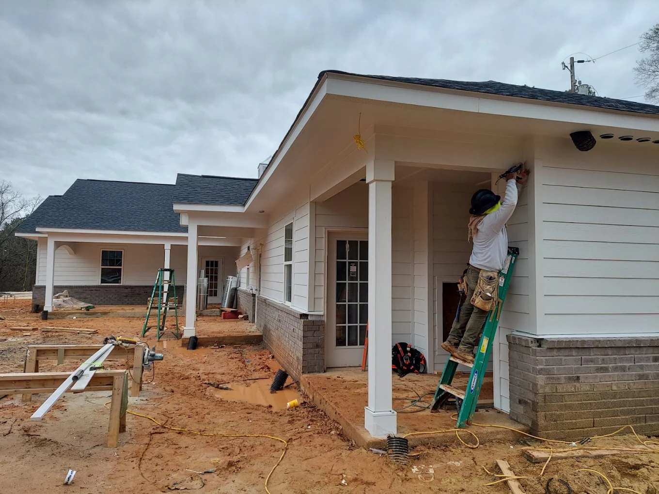 Worker installing siding